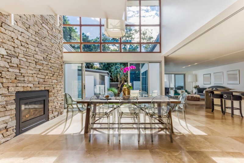 living room with large rectangle window and garden view